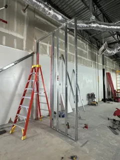 Timestamped job site photo of completed metal stud framing